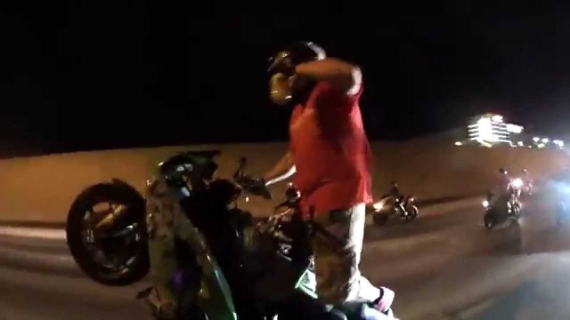 Crazy stunt rider drinks a 40oz while riding wheelie down highway